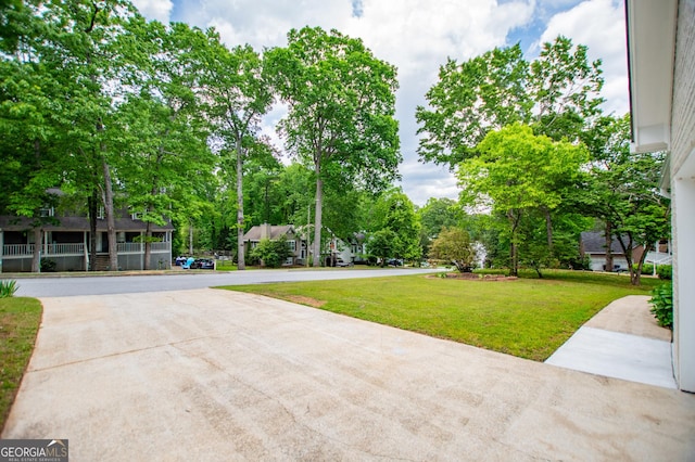view of home's community with a yard