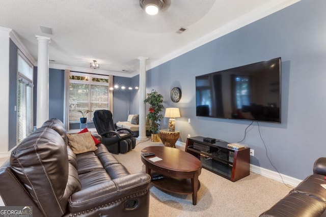 living room featuring crown molding, carpet, baseboards, decorative columns, and visible vents
