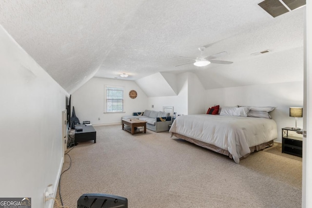 carpeted bedroom with ceiling fan, a textured ceiling, visible vents, baseboards, and lofted ceiling