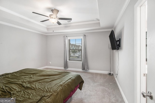7762 Fawn Cir, Covington, GA 30014 - bedroom with light carpet, ornamental molding, a raised ceiling, and a ceiling fan