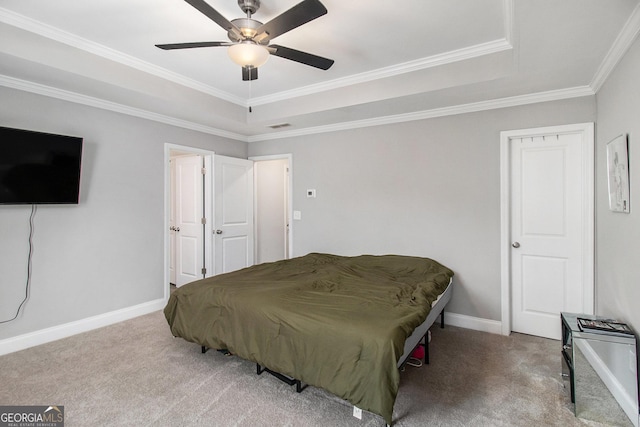 7762 Fawn Cir, Covington, GA 30014 - bedroom featuring carpet flooring, ornamental molding, a raised ceiling, and ceiling fan