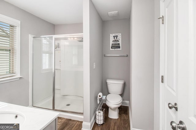 7762 Fawn Cir, Covington, GA 30014 - bathroom featuring wood finished floors, a shower stall, and vanity