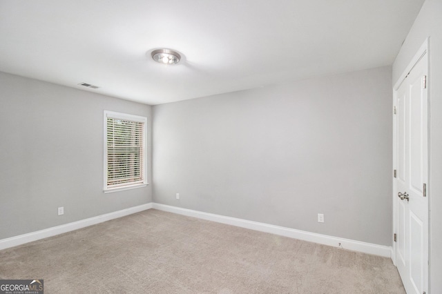 7762 Fawn Cir, Covington, GA 30014 - unfurnished bedroom featuring light colored carpet and baseboards