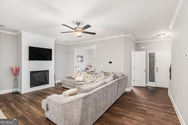 7762 Fawn Cir, Covington, GA 30014 - living room featuring wood finished floors, a ceiling fan, a large fireplace, and crown molding
