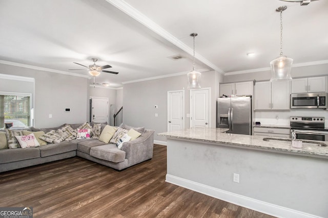 7762 Fawn Cir, Covington, GA 30014 - living area with dark wood-type flooring, ceiling fan, ornamental molding, and stairway