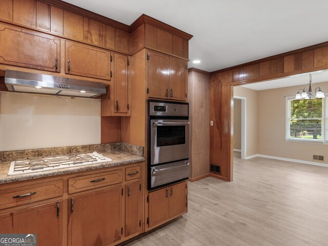 kitchen with visible vents, stainless steel oven, white gas cooktop, under cabinet range hood, and a warming drawer