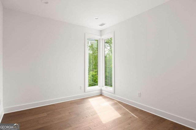 11542 Serenbe Ln, Chattahoochee Hills, GA 30268 - unfurnished room featuring baseboards, wood finished floors, and visible vents