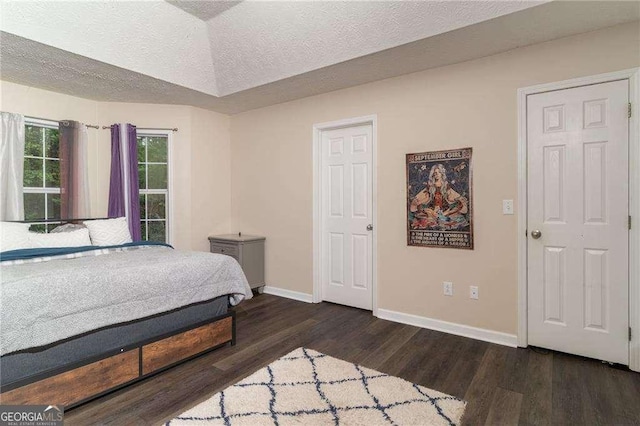204 Queensbury Ct, Acworth, GA 30102 - bedroom featuring baseboards, a textured ceiling, and dark wood-style flooring