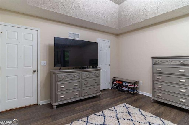204 Queensbury Ct, Acworth, GA 30102 - bedroom with a textured ceiling, baseboards, visible vents, and dark wood-style floors
