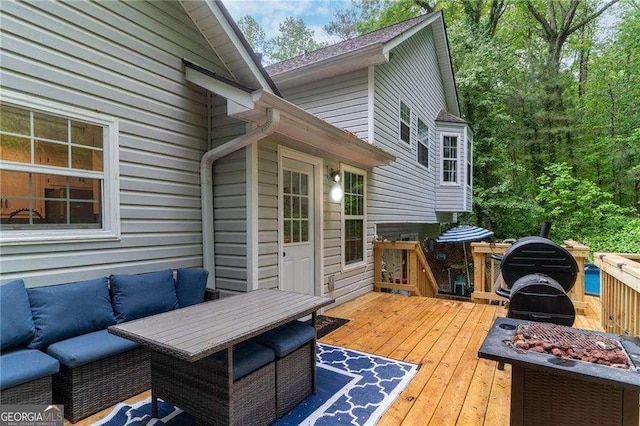 204 Queensbury Ct, Acworth, GA 30102 - wooden deck with an outdoor living space with a fire pit
