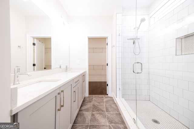 915 Katie Kerr Dr, Decatur, GA 30030 - full bath featuring double vanity, a walk in closet, a sink, and a stall shower