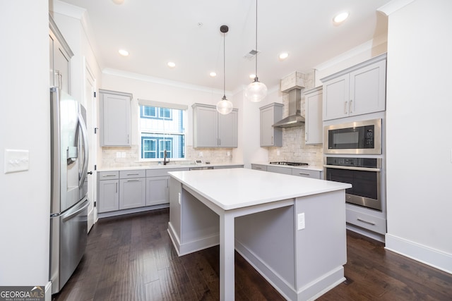 915 Katie Kerr Dr, Decatur, GA 30030 - kitchen with decorative backsplash, wall chimney exhaust hood, dark wood-style floors, and stainless steel appliances