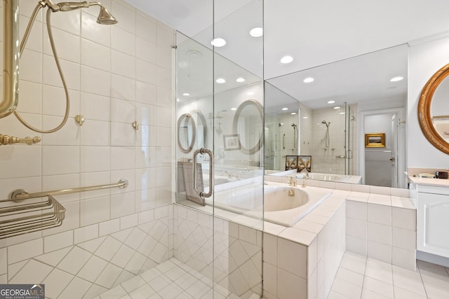 2660 Peachtree Rd Unit 7F, Atlanta, GA 30305 - bathroom with a garden tub, tile patterned flooring, a shower stall, vanity, and recessed lighting