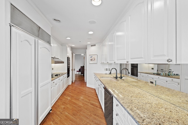 2660 Peachtree Rd Unit 7F, Atlanta, GA 30305 - kitchen with white cabinetry, a sink, and black appliances