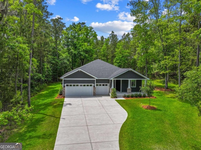 ranch-style house with a front lawn, a garage, a porch, concrete driveway, and a wooded view