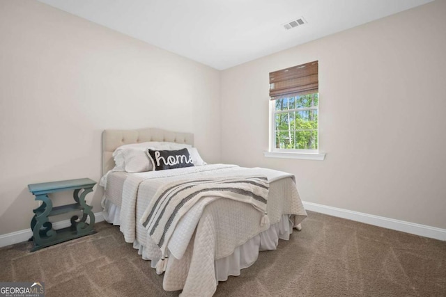 bedroom with baseboards, carpet, and visible vents