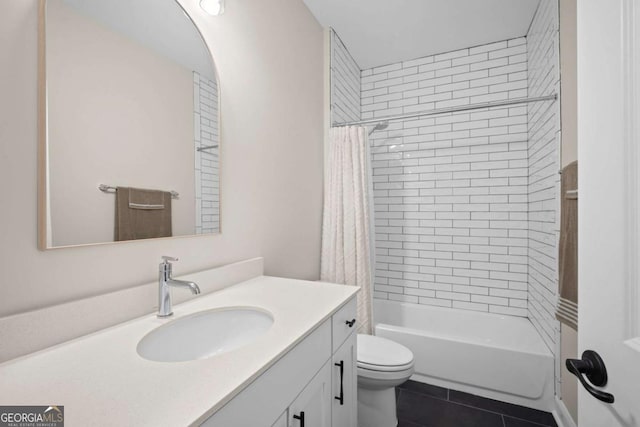 bathroom featuring tile patterned floors, shower / bathtub combination with curtain, vanity, and toilet
