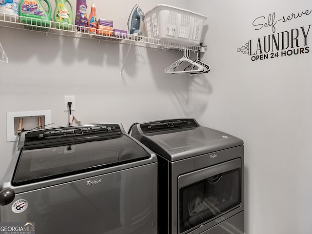 laundry room with laundry area and washing machine and clothes dryer