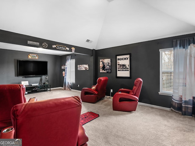 cinema featuring baseboards, carpet, high vaulted ceiling, and visible vents