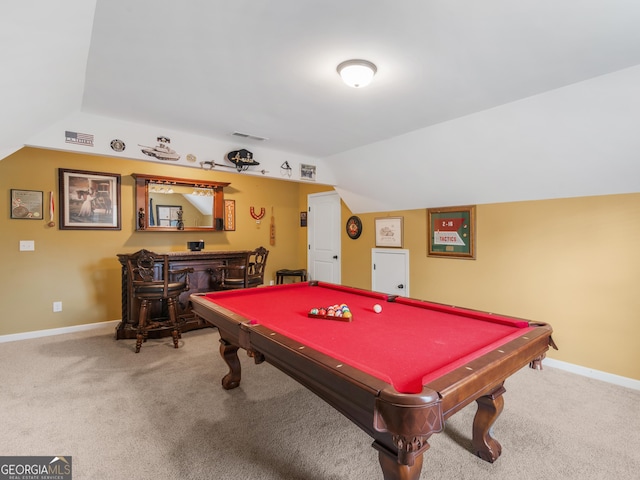 game room with carpet flooring, visible vents, baseboards, vaulted ceiling, and a bar