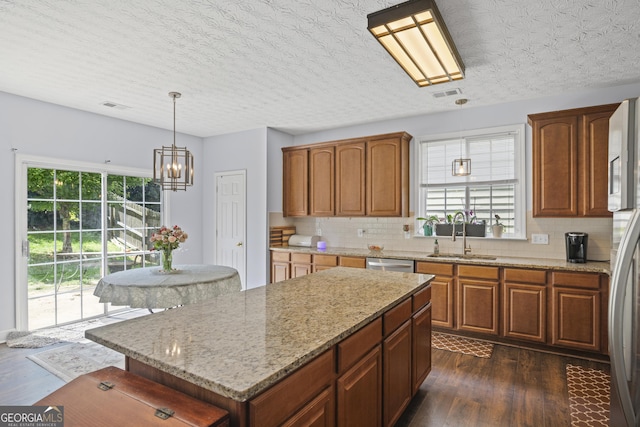 35 Timber Ln, Newnan, GA 30265 - kitchen featuring dark wood-style flooring, plenty of natural light, tasteful backsplash, and a textured ceiling