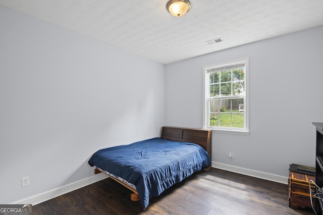 35 Timber Ln, Newnan, GA 30265 - bedroom featuring wood finished floors and a textured ceiling