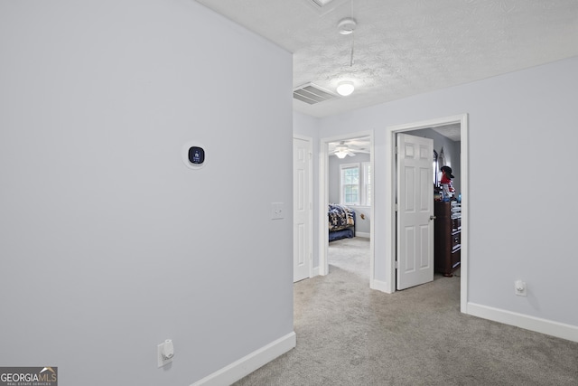 35 Timber Ln, Newnan, GA 30265 - hall featuring carpet floors, attic access, and a textured ceiling