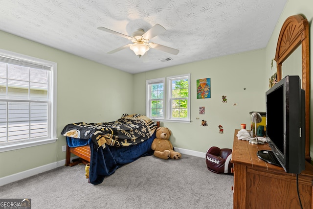 35 Timber Ln, Newnan, GA 30265 - bedroom featuring carpet floors, a textured ceiling, and a ceiling fan