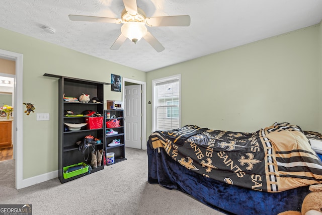 35 Timber Ln, Newnan, GA 30265 - bedroom with carpet flooring, a ceiling fan, a closet, and a textured ceiling