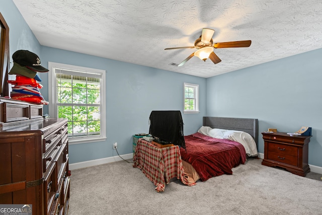 35 Timber Ln, Newnan, GA 30265 - bedroom with a textured ceiling, carpet, and a ceiling fan
