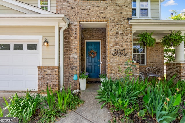 35 Timber Ln, Newnan, GA 30265 - doorway to property featuring brick siding and a garage