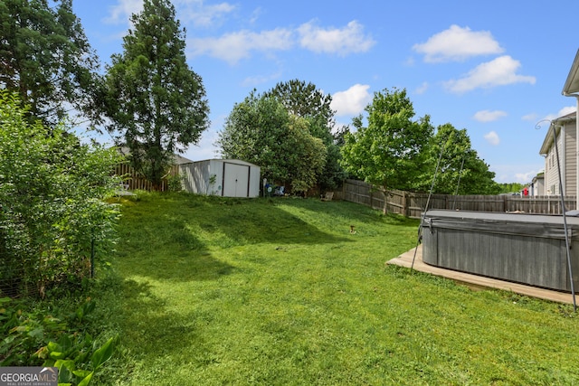 35 Timber Ln, Newnan, GA 30265 - fenced backyard with a hot tub and a storage unit