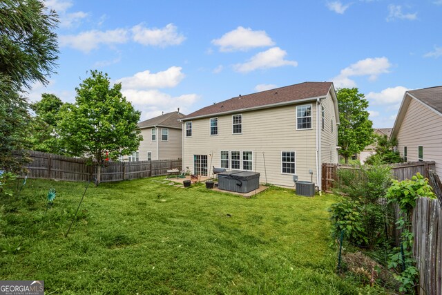 35 Timber Ln, Newnan, GA 30265 - back of house featuring a hot tub and a fenced backyard