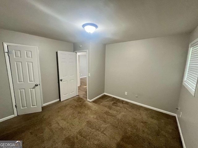 1263 Shoreham Dr, Atlanta, GA 30349 - unfurnished bedroom featuring carpet flooring and baseboards