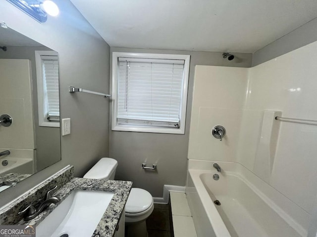 1263 Shoreham Dr, Atlanta, GA 30349 - bathroom featuring vanity, toilet, baseboards, and bathtub / shower combination