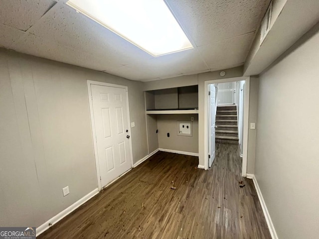 1263 Shoreham Dr, Atlanta, GA 30349 - laundry room with laundry area, baseboards, and dark wood-type flooring