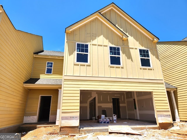 10 Umber Ln Lot 3, Newnan, GA 30263 - view of front of house featuring board and batten siding, a garage, and a shingled roof