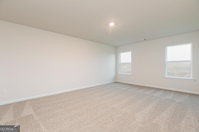 244 Oliver Dr, Locust Grove, GA 30248 - unfurnished room with baseboards, light carpet, recessed lighting, and visible vents