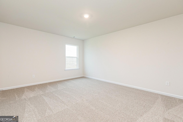 244 Oliver Dr, Locust Grove, GA 30248 - unfurnished room with baseboards and light carpet