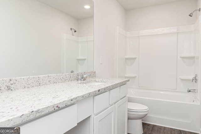 244 Oliver Dr, Locust Grove, GA 30248 - full bathroom with vanity, shower / bathing tub combination, toilet, and wood finished floors