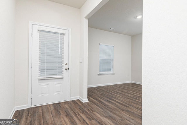 244 Oliver Dr, Locust Grove, GA 30248 - foyer with dark wood-style flooring, baseboards, and visible vents