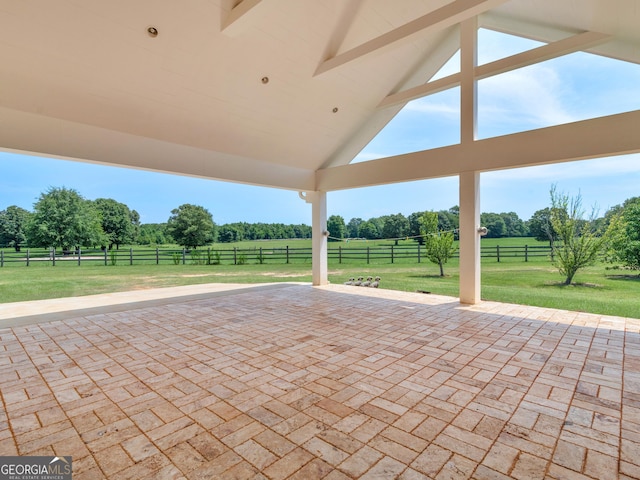 view of patio / terrace featuring fence and a rural view