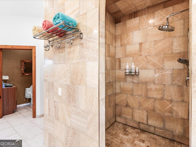 full bath with tile patterned flooring and tiled shower