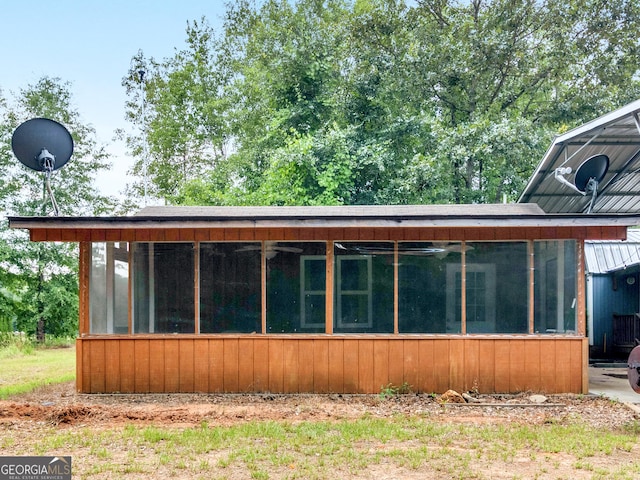 exterior space featuring a sunroom