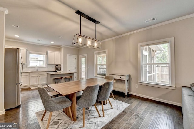 6468 Pierless Ave, Sugar Hill, GA 30518 - dining space with visible vents, ornamental molding, and dark wood-type flooring