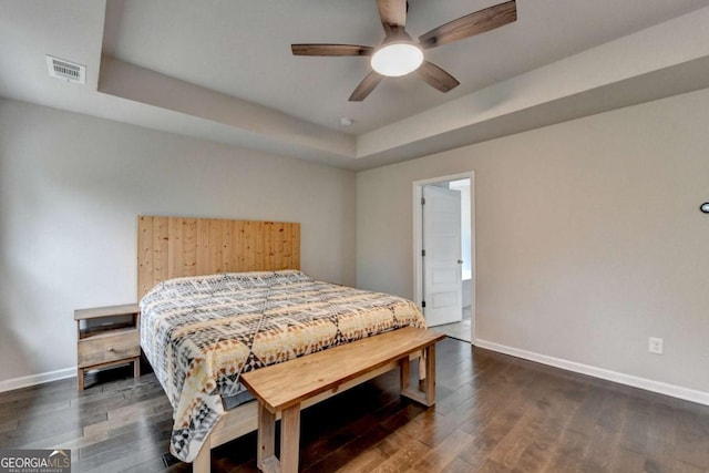 6468 Pierless Ave, Sugar Hill, GA 30518 - bedroom featuring visible vents, a raised ceiling, baseboards, and dark wood finished floors