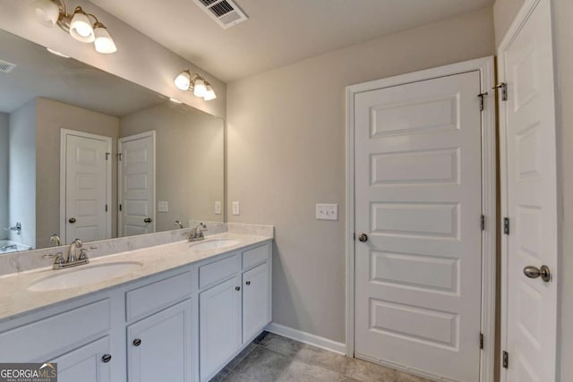 6468 Pierless Ave, Sugar Hill, GA 30518 - full bathroom with double vanity, visible vents, and a sink