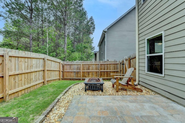 6468 Pierless Ave, Sugar Hill, GA 30518 - view of patio featuring a fenced backyard and an outdoor fire pit