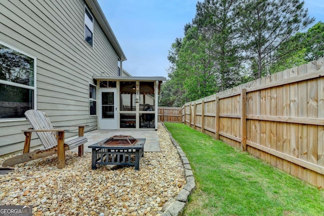 6468 Pierless Ave, Sugar Hill, GA 30518 - view of yard featuring a fenced backyard, a sunroom, and a fire pit