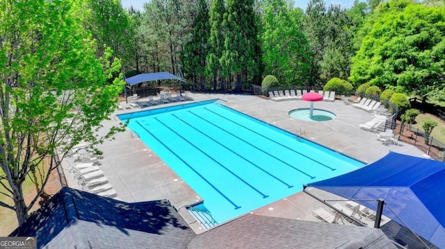 6468 Pierless Ave, Sugar Hill, GA 30518 - community pool featuring a view of trees, a patio area, and fence